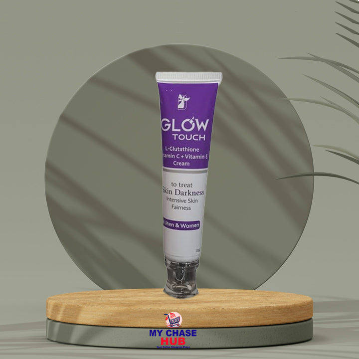 Glow Touch cream tube on a wooden stand with a green leafy background