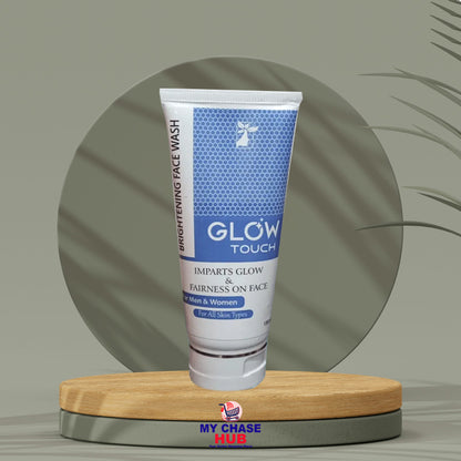 Tube of 'Glow Touch' face wash on a wooden stand with a green background