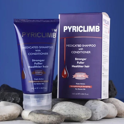 Pyriclimb shampoo tube and box on a blue background with stones.