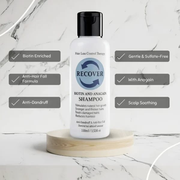 Shampoo bottle labeled 'Recover' on a marble background with feature text.